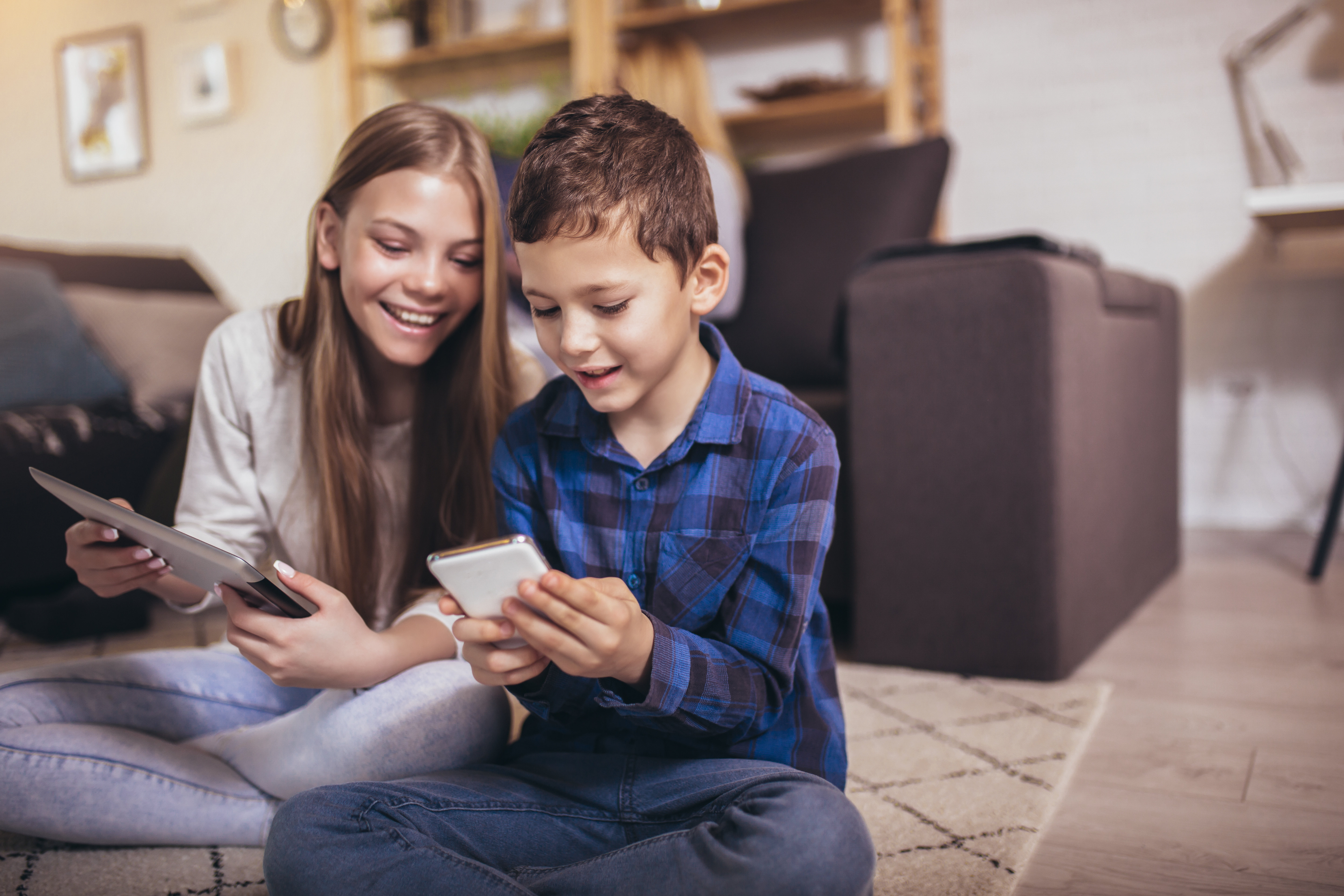 girl and boy with tablets