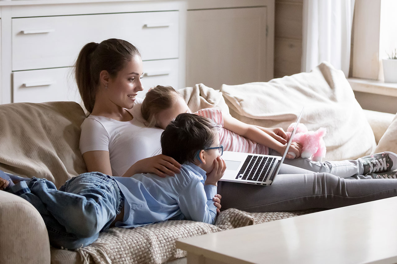 mother with kids on the sofa