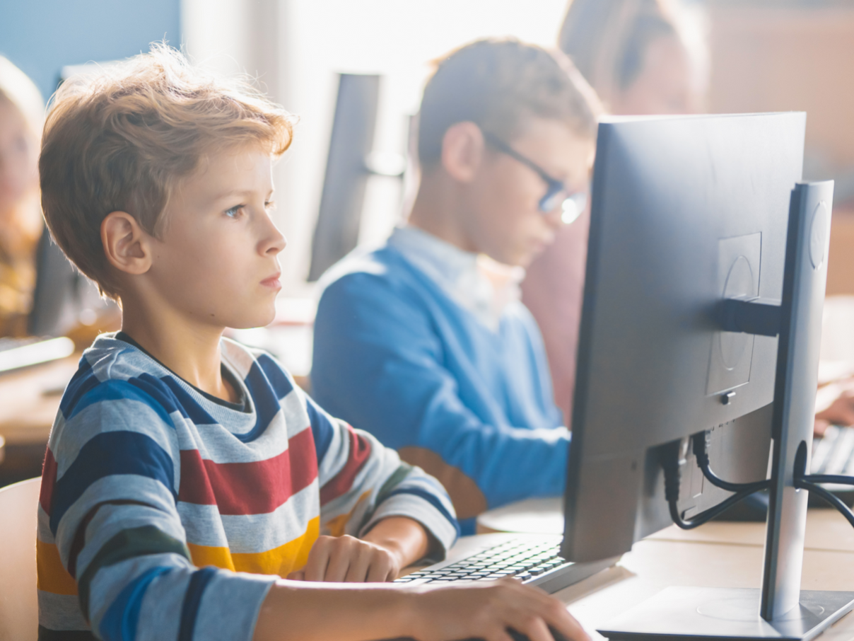 Children at computers in the classroom